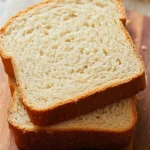 gluten-free bread sliced loaf on cutting board