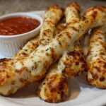Cheesy Halloween Breadstick Bones with Marinara Blood for Dipping
